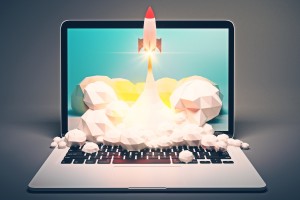 Startup concept with rocket flying out of laptop screen on grey background. 3D Rendering